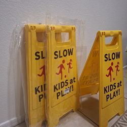 Slow Down Kids Playing Sign 
