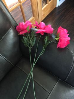Three long stem artificial flowers