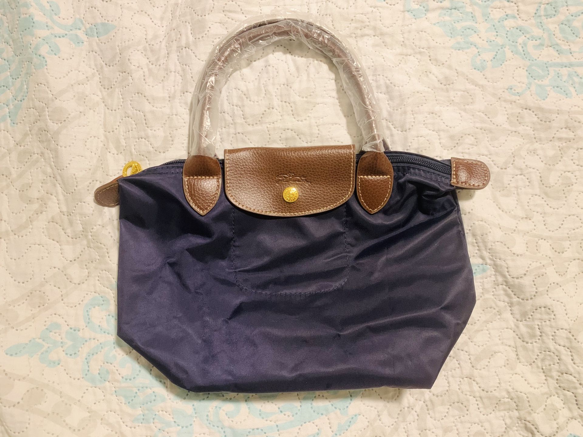 Small navy blue long champ style tote bag