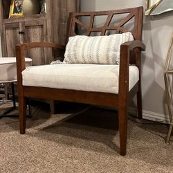 Stylish wooden accent chair with a modern geometric backrest and a comfortable cushioned seat. Gently used, clean, and well‑maintained. Perfect for a 