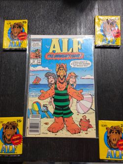 Alf comic book and 4 packs of unopened alf cards