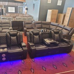 brand new fully loaded power reclining living room sofa and loveseat set, made of leather.