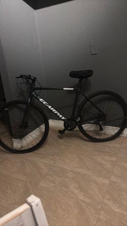 an Ecarpat Druk 700x28C Road Bike.