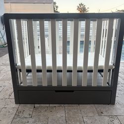 mini crib with trundle drawer