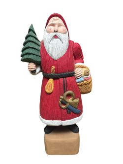 This is a hand-carved and painted folk art Santa Claus figurine, potentially.  The figurine is made of carved wood, likely basswood.  It is a vintage 