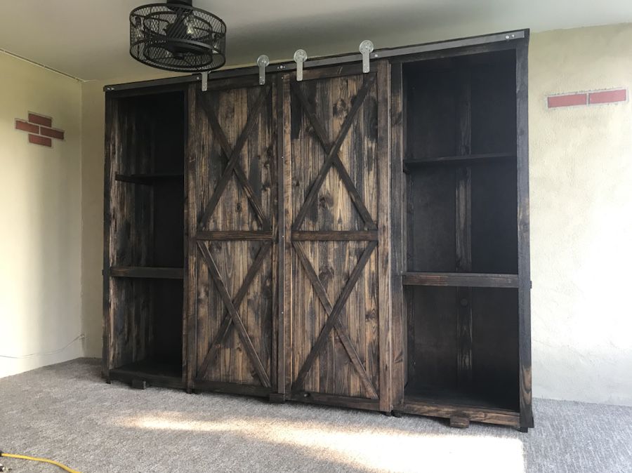 Custom artistic barn doors, cabinets, consoles, headboards , dining sets , display cabinets potting tables or anything else. 40 years experience. Jus
