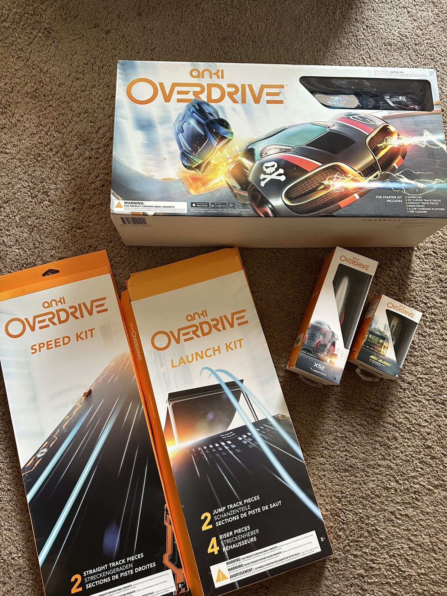 Anki Overdrive Starter Kit + There is a extra car  And Extra Pairs Of Tracks And Jump Kits And Super truck