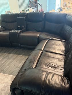 Dark brown leather reclining sectional sofa