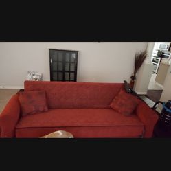 red sofa bed/storage on bottom.