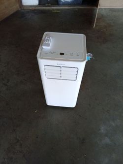 Portable air conditioner with accessories.