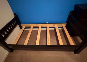 Black twin size bed frame with matching dresser