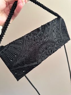 Elegant black beaded purse with mirror