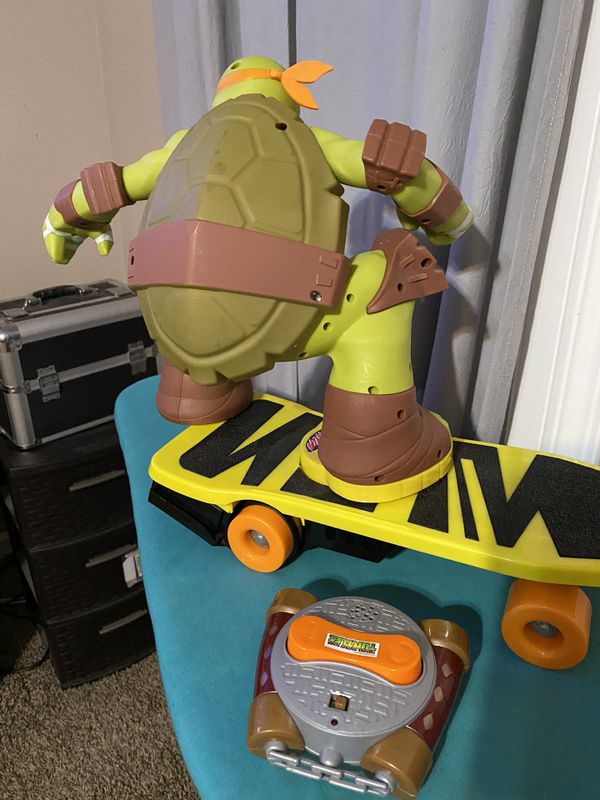 ninja turtle toy on skateboard