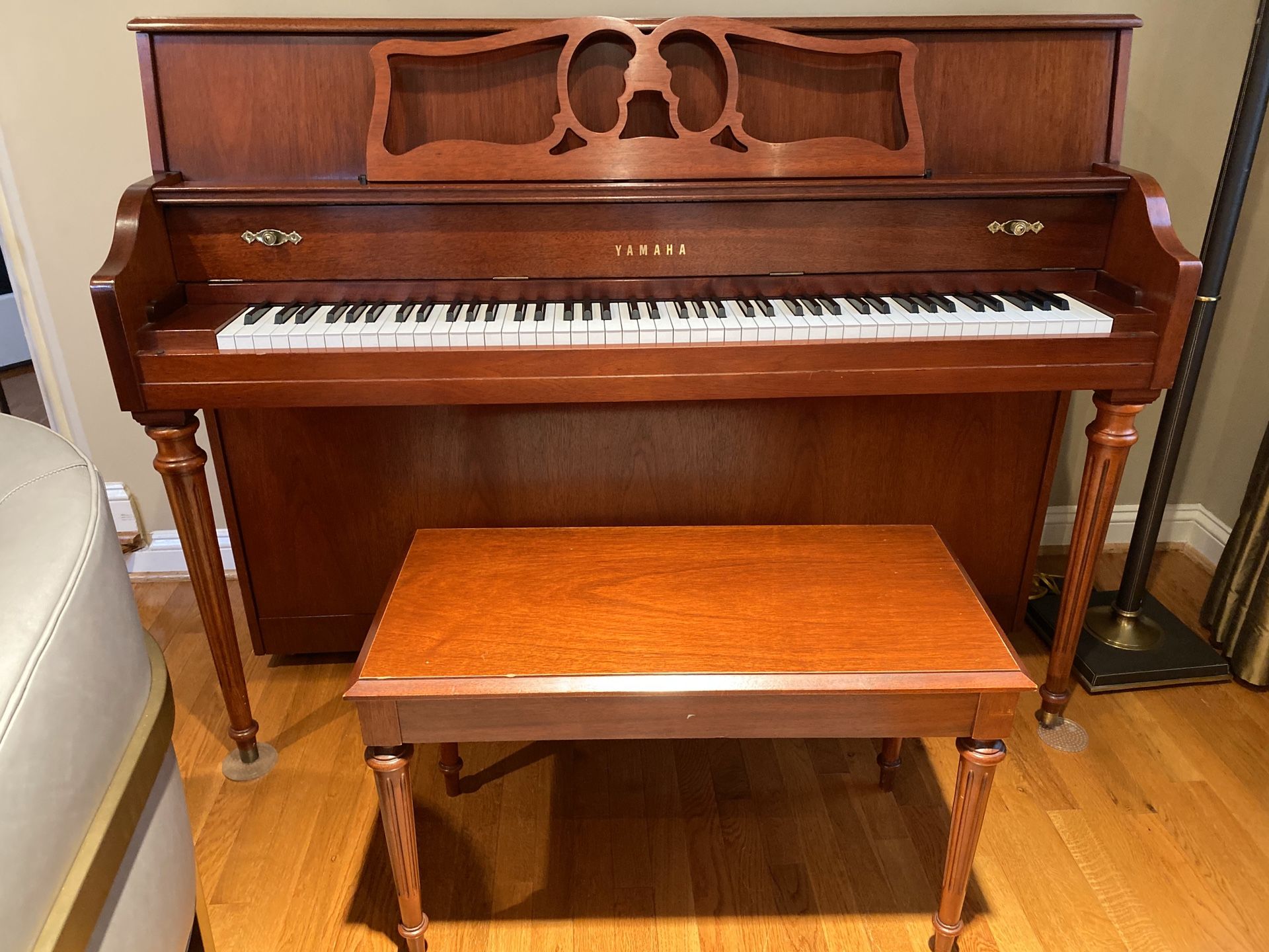 Yamaha upright piano and bench, approximately five years old in like new condition. Moving and must sale.