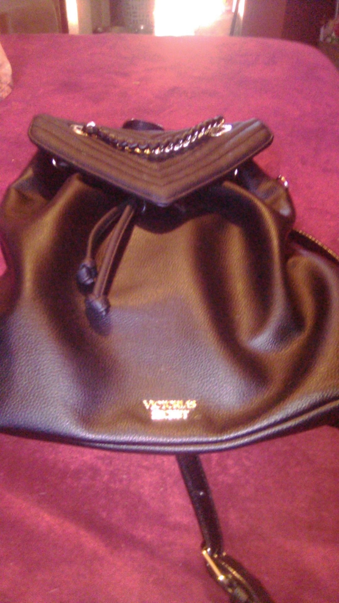 Victoria's Secret Black Backpack Purse with gold chain accents.