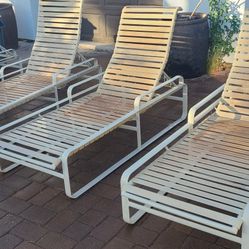Four outdoor pool lounge chairs
