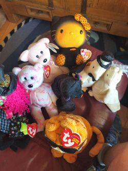 Several containers full of Beanie Babies some from the 80s.
