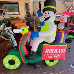 Frosty The Snowman Riding A Moped. 