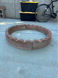 Red brick  sections  gos around trees or or flowers bed. 18 pieces total
