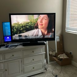 50 “ Sharp TV with stand /remote— 43” Wide X 27” High 