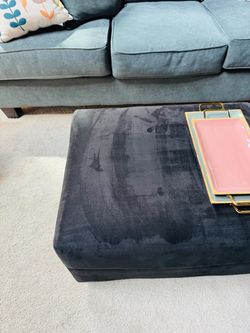 Black soft covered Ottoman