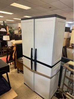 HDX Plastic Freestanding Garage Cabinet in gray with black handles and hardware.It measures approximately 35 inches wide by 71 inches high and include