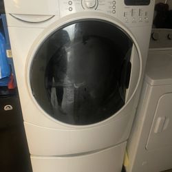 Whirlpool washing machine works my grandma just can’t lift her arms to get the clothes in and out anymore. It’s too tall for her and it comes with a d