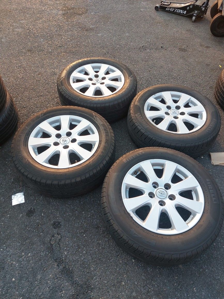 4 TOYOTA CAMRY RIMS AND TIRES. 16 INCH. 215.60.16