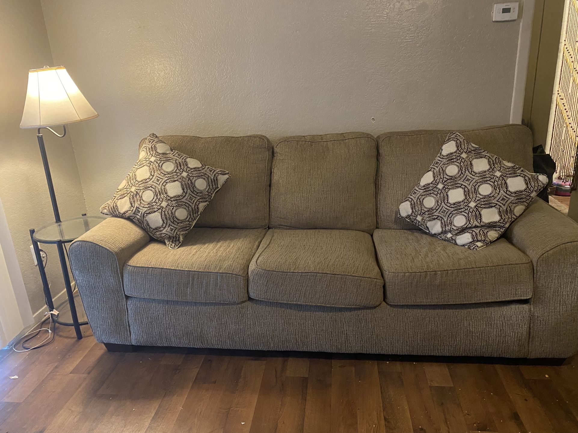 USED COUCH, COUCH PILLOWS AND LAMPSTAND