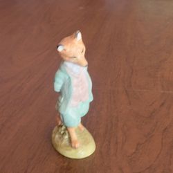 Vintage Beswick England Beatrix Potter Foxy Whiskered Gentleman 
figurine, modeled with a sage green coat.  Made in England. Heigh 4.75" 
. Pre-owned,