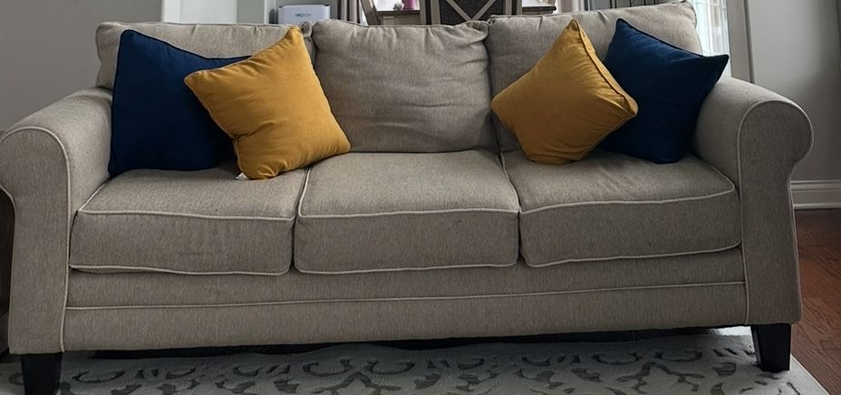 Two Matching Beige Sofas