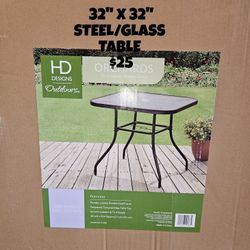 BRAND NEW, 32X32 STEEL/GLASS TABLE 