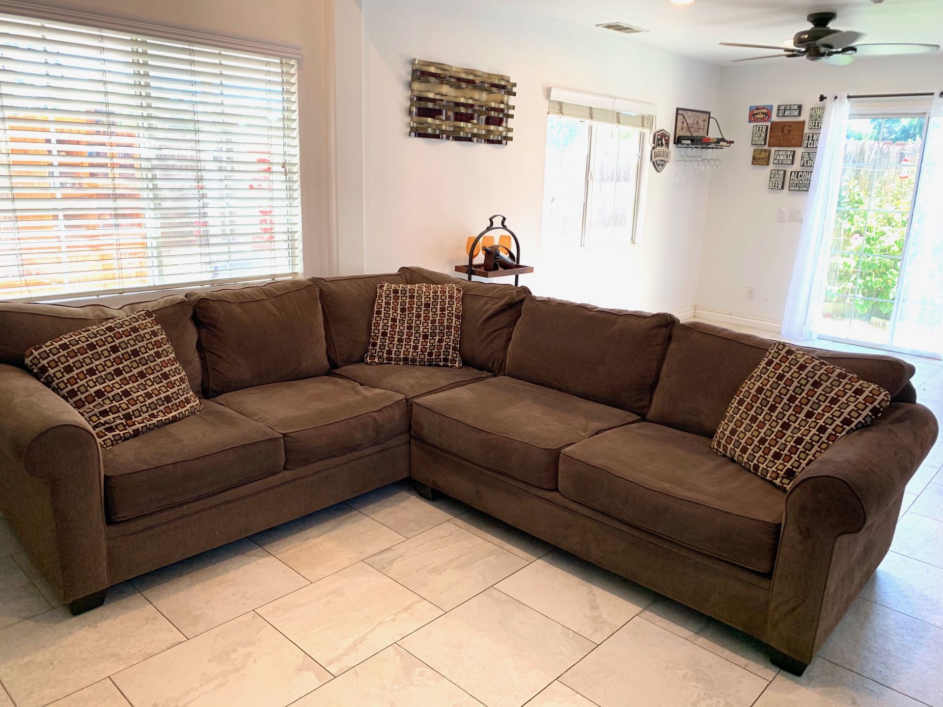 “Living spaces furniture” sectional. 109”/95”/31”/38”