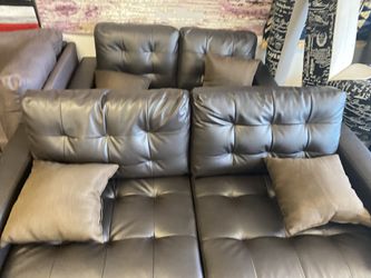 Brown bonded leather sofa and loveseat