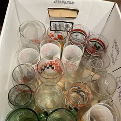 Box Full of Assorted Vintage Coca Cola Glasses for Different Prices 