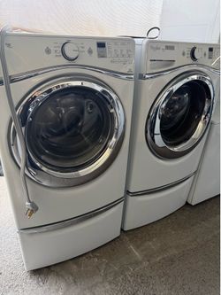 Whirlpool front load washer and electric dryer set