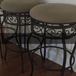Two counter height swivel stools
