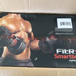 Set of 2 Adjustable dumbbells new in box 52 pounds - 5 pounds. For sale or trade. No They Are Not $1