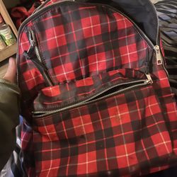 small red and black plaid backpack