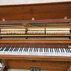 Used standing piano.