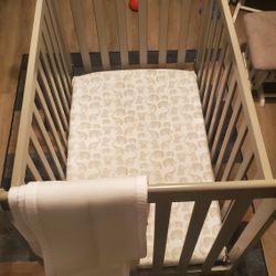 Grey Infants Crib, With Crib Liner And Mattress.