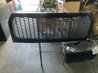 15-17 F150 Ford grill glossy black badge less open box slightly scratched