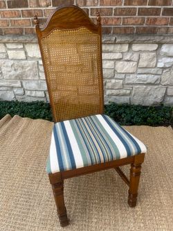 Vintage upholstered cane chair