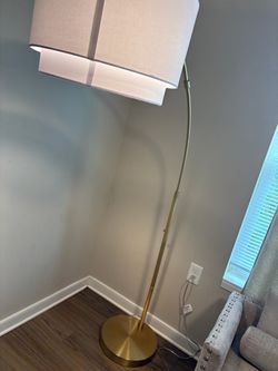Knurled gold metal floor lamp