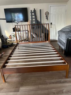 Brown queen sized bed