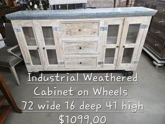 Cabinet Industrial W/ Metal Wheels We are located at 2811 East Bell road. Another Time Around Furniture.
