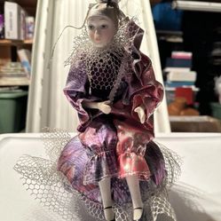 Four Vintage Collectible Porcelain Jester Music Boxes and a Porcelain Clown Doll