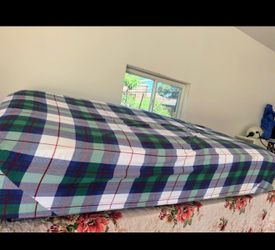 Twin bed with mattress and nightstand