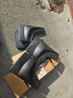 Set 4 mud flaps.  New in box 2017 Silverado or similar