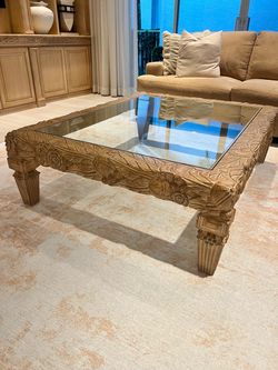 Elegant wood and glass coffee table 46” by 56”.